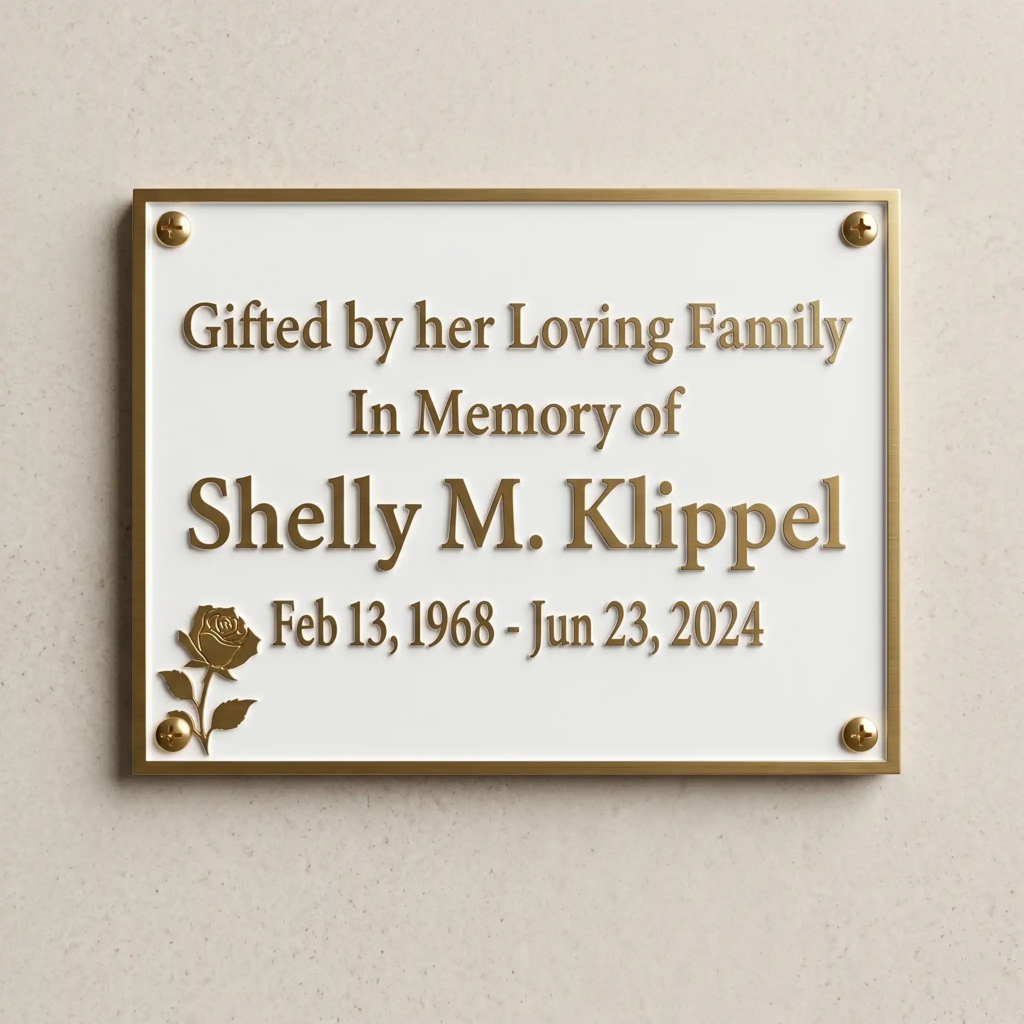 Memorial plaque for Shelly M. Klipple on a beige wall