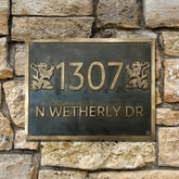Address plaque with '1307 N Wetherly DR' on a stone wall