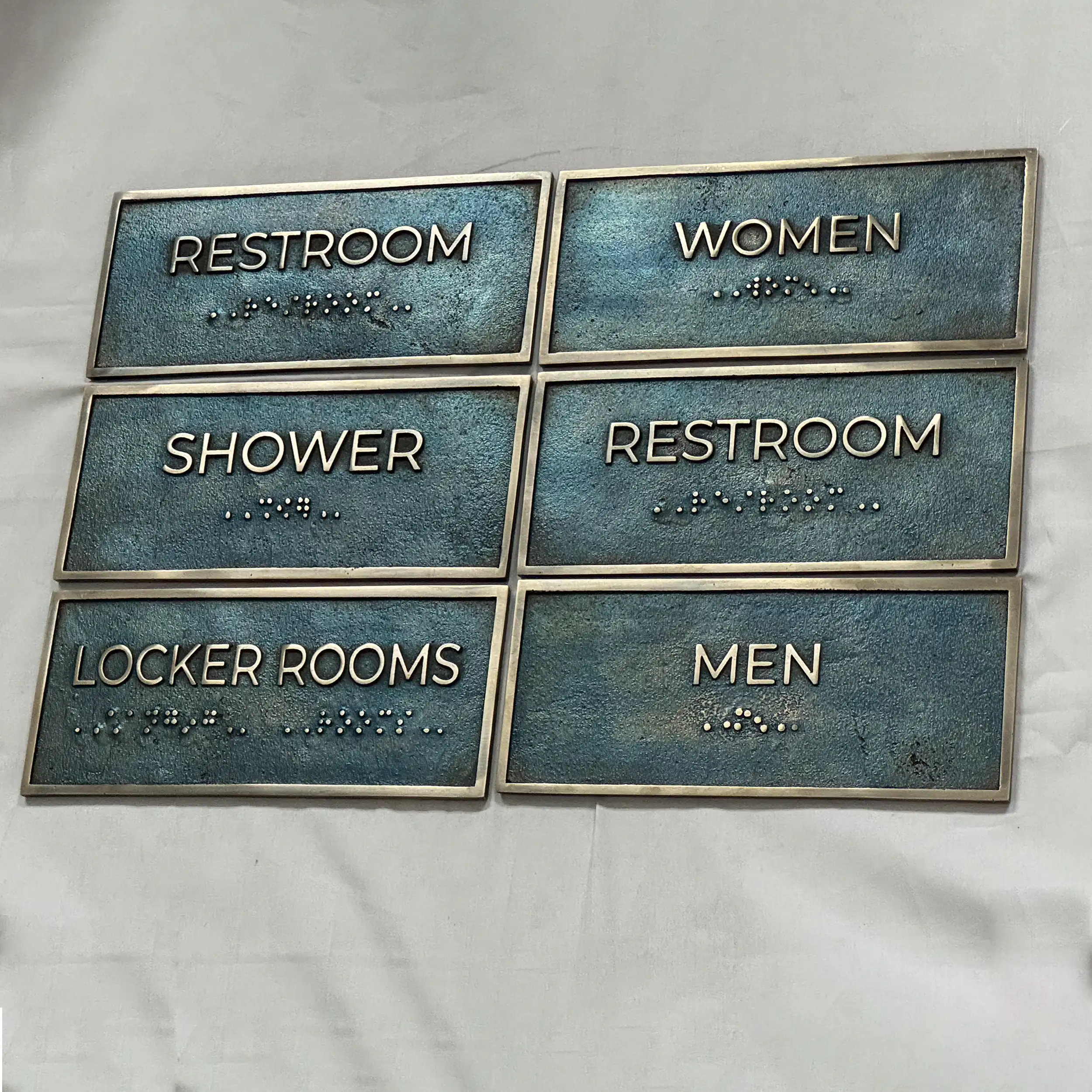 Set of restroom signs with Braille text on a white background - Bronze personalized office door plaque