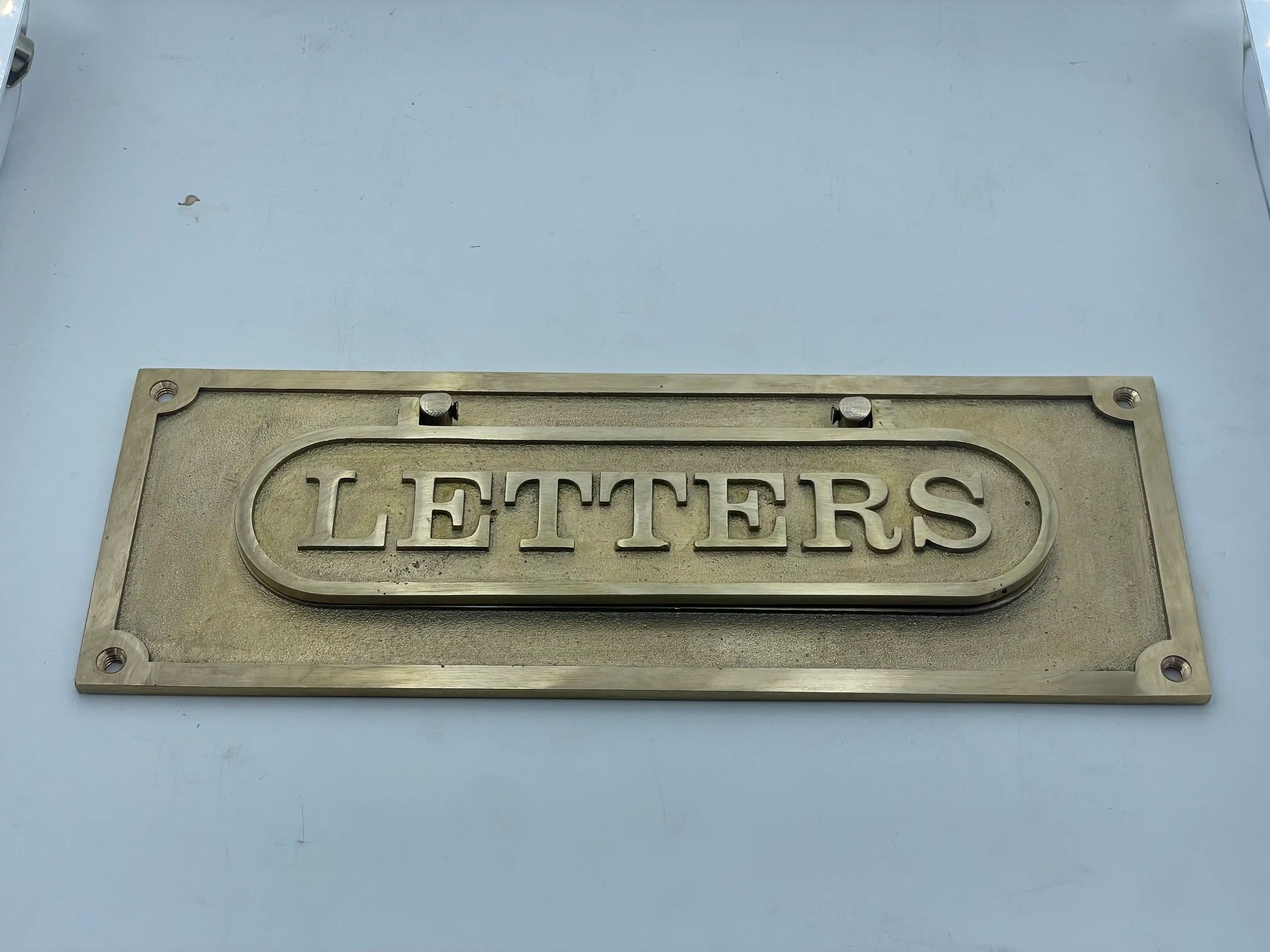 Brass letters box on a white background