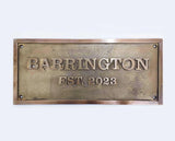 Bronze plaque with 'Barrington Est. 2023' text on a white background
