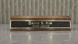 Custom brass office name sign black background