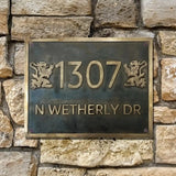 Address plaque with '1307 N Wetherly DR' on a stone wall