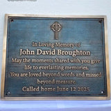 Memorial plaque for John David Broughton with a Celtic cross design on a blue background.