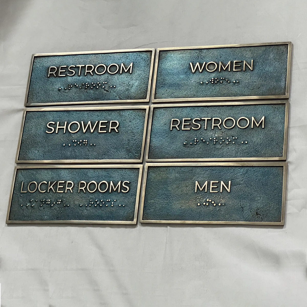 Set of restroom signs with Braille text on a white background - Bronze personalized office door plaque