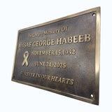 Memorial plaque for Ansaaf George Habeeb with a bronze finish on a white background