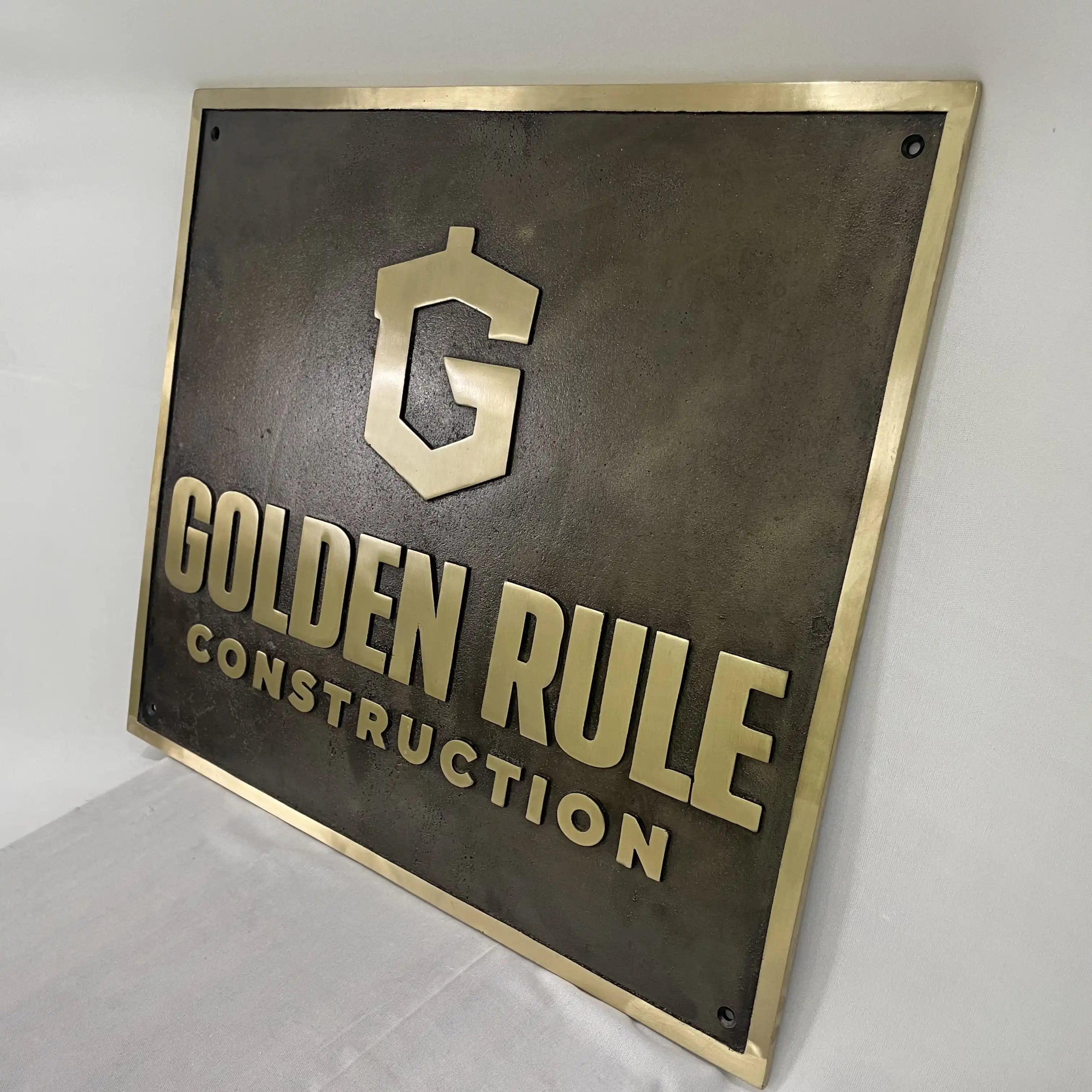 Bronze Metal sign with 'Golden Rule Construction' logo on a white background