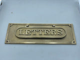 Brass letters box on a white background