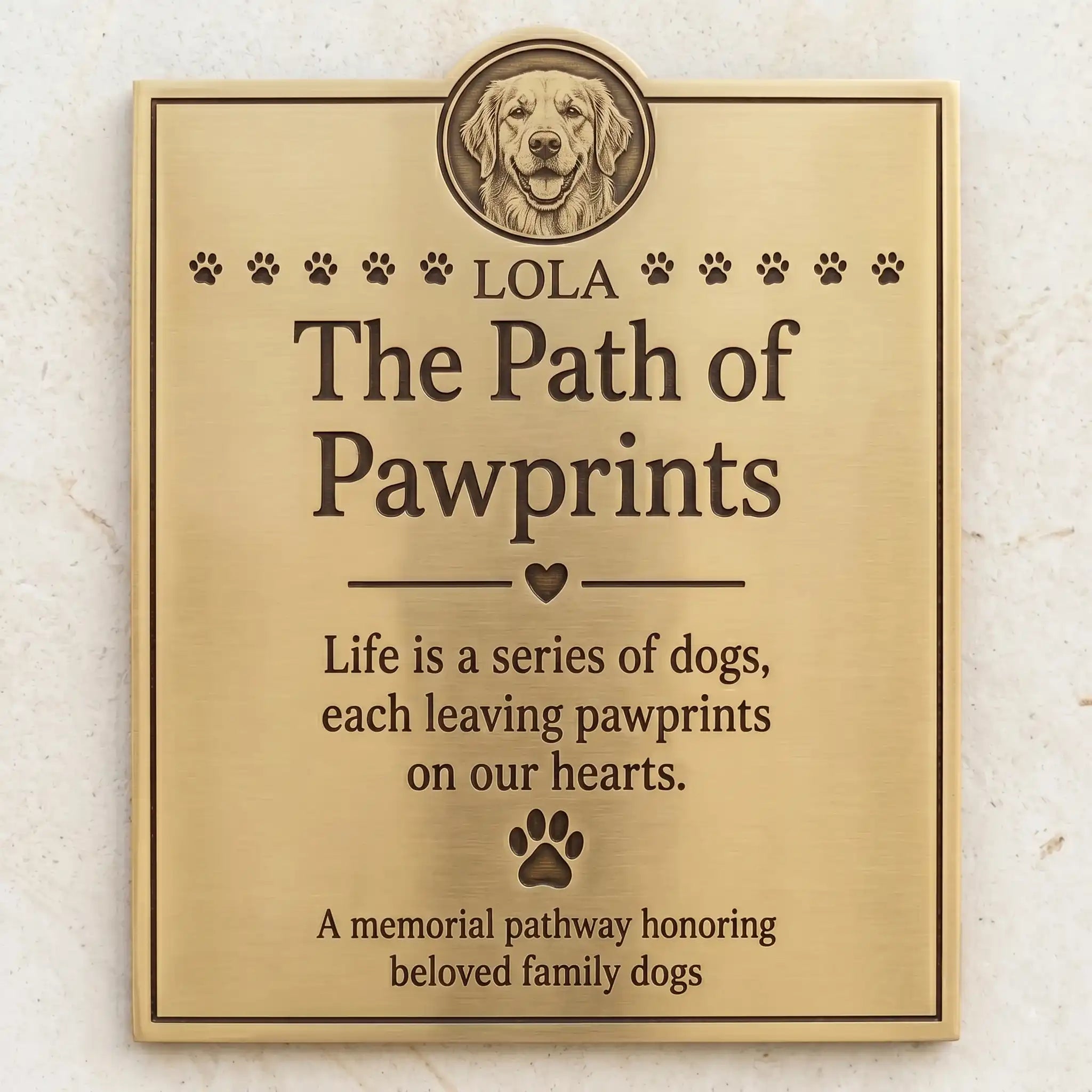 Memorial plaque for dogs with engraved text and a dog's face, on a light background.