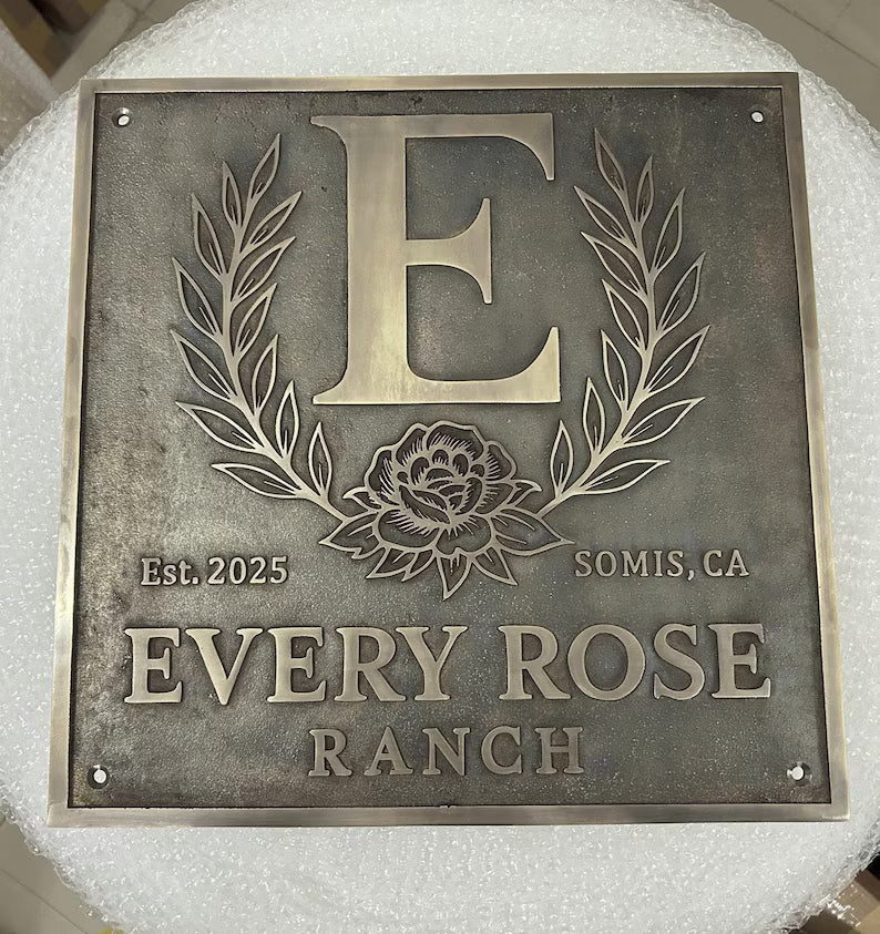 Custom Bronze Plaques -  Address Plaques with 'E' and floral design, featuring 'Every Rose Ranch' text.
