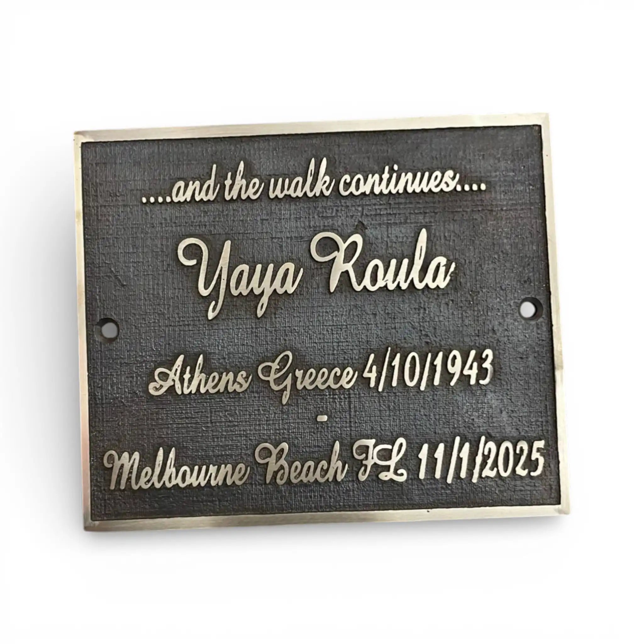 Memorial plaque with engraved text on a white background