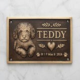 Bronze Memorial plaque for a dog named Teddy with a heart and dates on a marble background